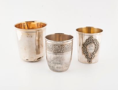 null Set of three silver goblets (950): 

- A plain one with a neck underlined by...
