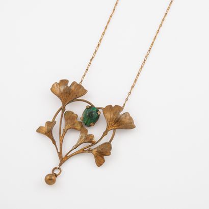null Gold-plated metal necklace made of a chain holding a large hammered and patinated...