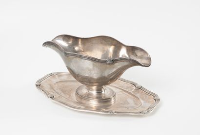 Sauceboat on pedestal with two spouts in...