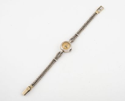 OMEGA Montre bracelet de dame en or gris (750). 

Boîtier rond.

Cadran à fond beige...