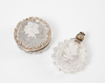 null LOT OF TWO FLASKS AND A ROUND PILLS BOX In cut crystal, mounted in metal, decorated...