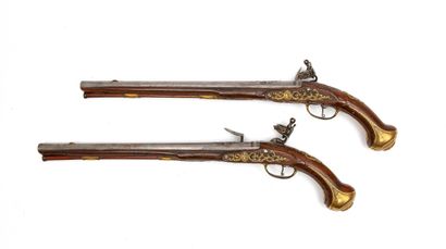 France Pair of large flintlock pommel guns.
Flat-bodied locks, underlined by wavy...