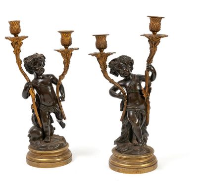 null 
PAIR OF CANDELABRES In the taste of CLODION.



In gilt bronze and brown patina,...