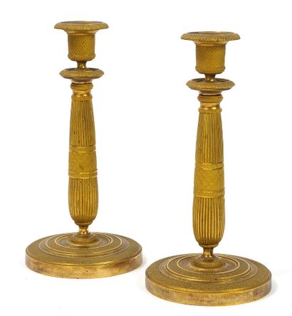 null 
PAIR OF TORCHES 



In gilt brass, with swollen and ribbed stem, ringed with...