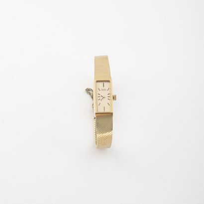 SEIKO Lady's wristwatch in gilt metal and steel. 

Rectangular case. 

Dial with...