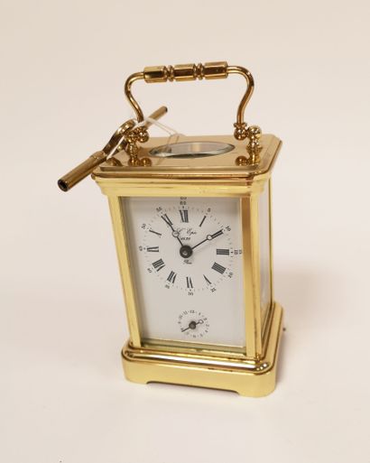 L'Epée à Paris Officer's clock with brass cage, glazed on all sides. 
White enamelled...