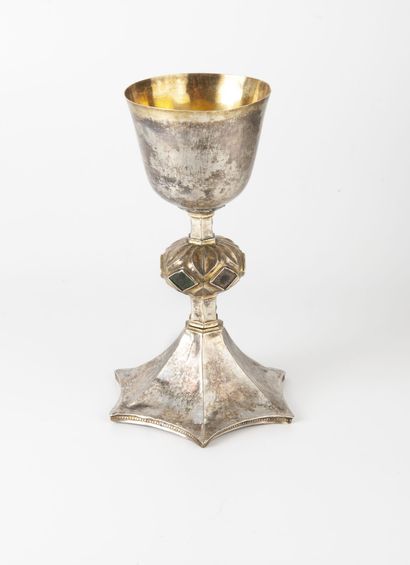 null Silver chalice (min. 800) partly gilded.
Hexagonal shaft with bulbous knot in...