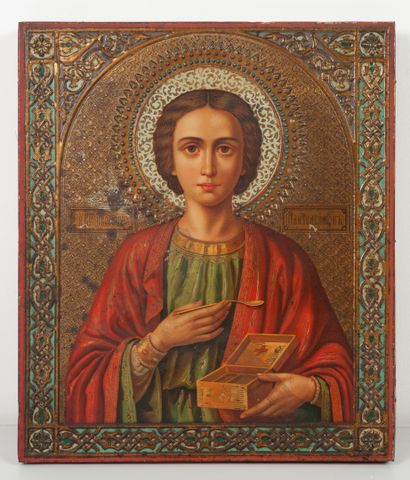RUSSIE, XIXème siècle Saint Panteleimon. 

Icone en bois et tôle avec reliefs peinte....