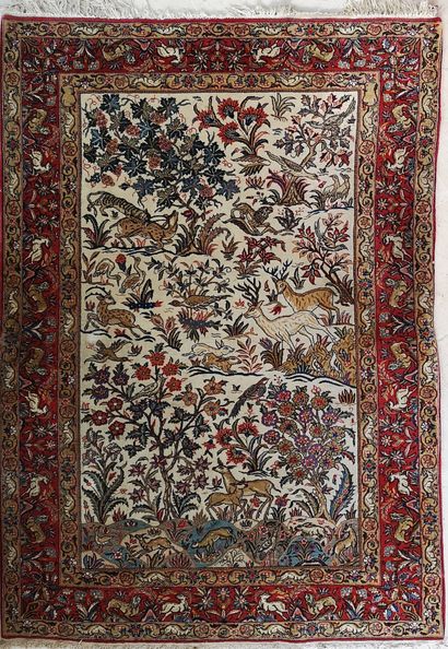 IRAN, XXème siècle Rectangular Ghoum type carpet in polychrome wool decorated with...