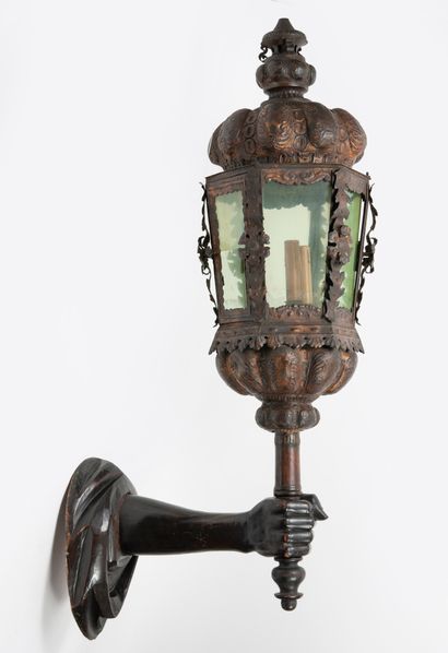 null Wall lamp in the form of an arm holding a lantern in blackened wood and cut...
