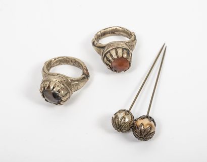 - Two silver-plated metal rings, decorated...