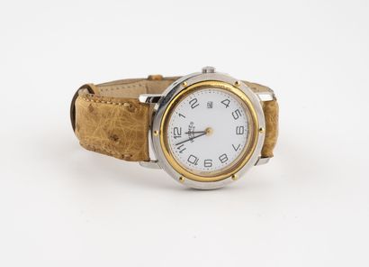 HERMES Paris Ladies' wristwatch.

Signed circular steel case. 

White enamelled dial,...