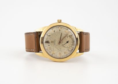 OMEGA Men's wristwatch. 

Round case in yellow gold (750) 

Dial with copper background,...