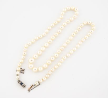  Necklace made of white cultured pearls. 
White gold (750) ratchet clasp set with...