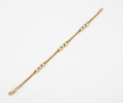 null Yellow and white gold (750) bracelet with braided mesh and alternating X-shaped...
