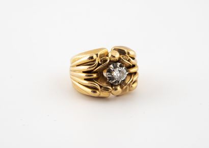 null Yellow and white gold (750) signet ring centered on a brilliant-cut diamond...
