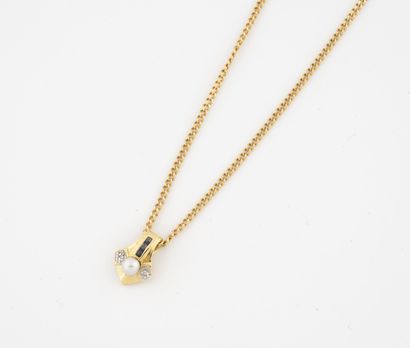 null Yellow gold (750) necklace holding a yellow gold (750) pendant centered on a...