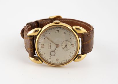 JUMI Génève Men's wristwatch. 
Round case in yellow gold (750). 
Dial with champagne...
