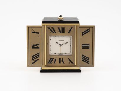 CARTIER Paris, Triptyque A gilt brass and black enamel clock, rectangular in shape,...