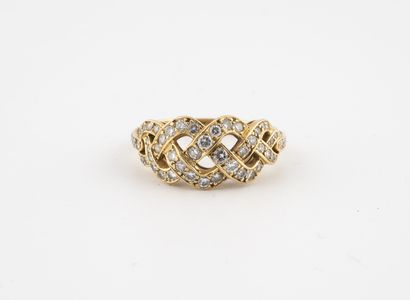 null Yellow gold (750) ring with braiding set with small brilliant-cut diamonds....