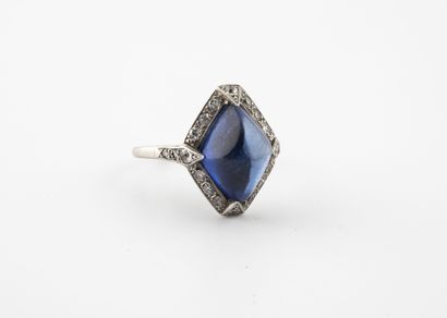 null Platinum ring (850), the diamond-shaped plate centered with a synthetic sapphire...