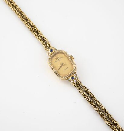 BAUME & MERCIER Montre bracelet de dame en or jaune (750) 

Boîtier octogonal. 

Lunette...
