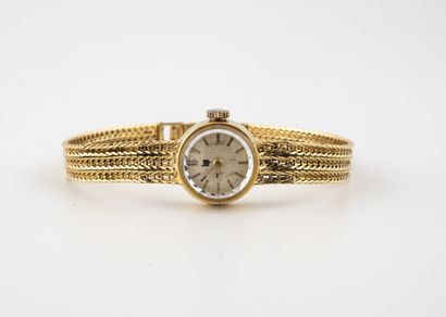 LIP Ladies' wristwatch in yellow gold (750). 
Round case. 
Dial with champagne background,...
