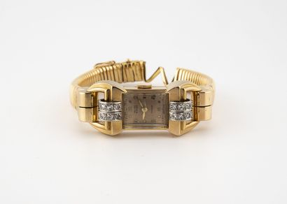 NATALIS Montre bracelet de dame. 
Boîtier en or jaune (750), à attaches rouleaux...