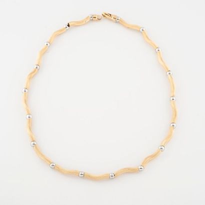 Amusant collier composé de perles d'or jaune...