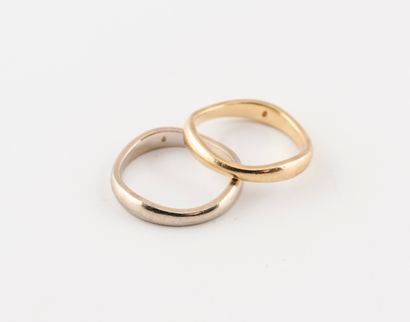 CARTIER Two wedding rings in yellow and white gold (750) with an eventful shape.

Goldsmith's...