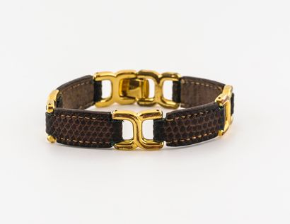 HERMÈS Paris, Beauvau Brown lizard leather bracelet with saddle stitching alternating...