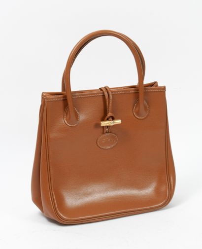 LONGCHAMP, Roseau Smooth camel leather handbag, golden metal Roseau clasp.

Two handles...