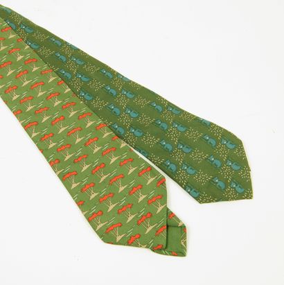 HERMES Paris Set of two silk ties. 

One decorated with palm trees, the other with...