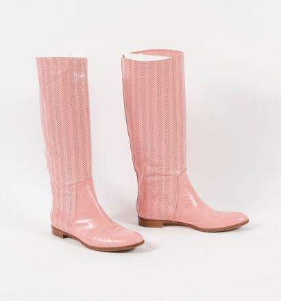 Sergio ROSSI Pair of perforated pink leather boots with round toe.

Size: 37.5. -...