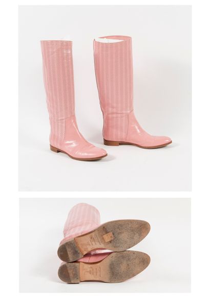 Sergio ROSSI Pair of perforated pink leather boots with round toe.

Size: 37.5. -...