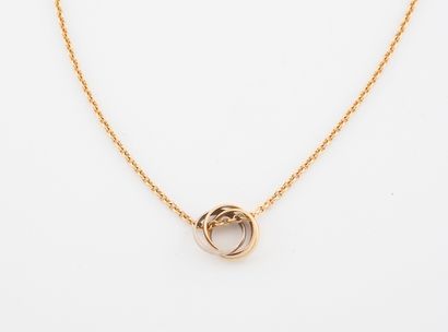 CARTIER, Trinity Yellow gold (750) forçat chain necklace holding a three-ring pendant...