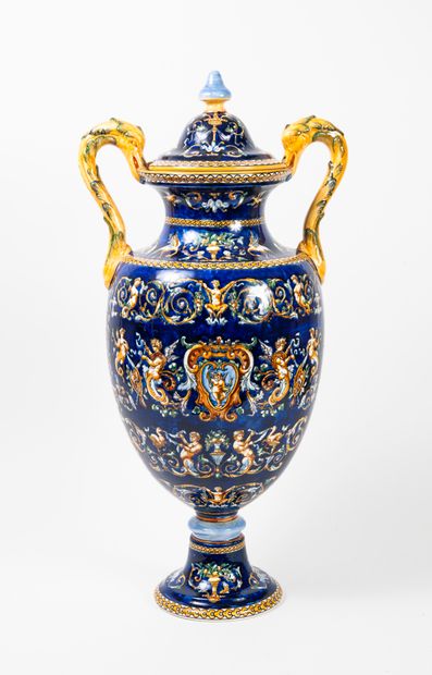 GIEN, A large covered earthenware vase, baluster shape, on a pedestal with two swan's...
