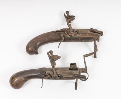EUROPE, fin du XVIIIème ou début du XIXème siècle Two pistol-shaped flint table lighters.

Angular...