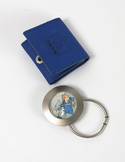 HERGE, MOULINSART Steel pocket watch. 

Round case with folding ring. 

Dial with...