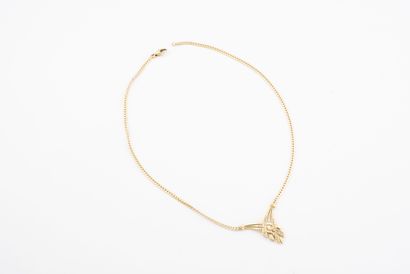  Yellow gold (750) flat link necklace, the neckline with a cross pattern adorned...