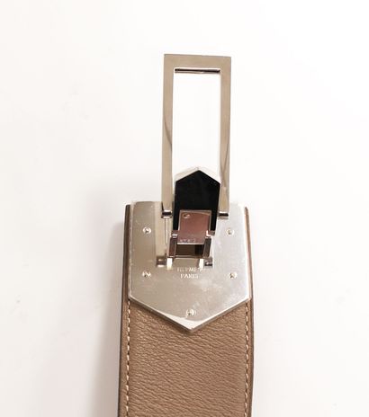 HERMES Paris, Lady's belt in smooth taupe leather with camel interior and white stitching.

Silver...