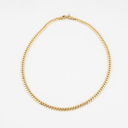 null Necklace in yellow gold (750) with flat gourmette link. 

Ratchet clasp with...