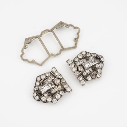 null Pair of silver (800) lapel ear clips set with faceted white stones in grain...