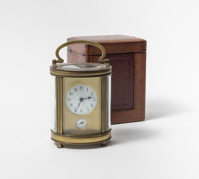  Officer's clock with gilt brass cage, oval section, with five rounded glasses. 
Gilded...