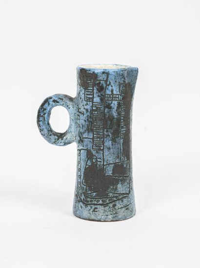 JACQUES BLIN (1920-1995) Pitcher with handle.

In blue glazed ceramic, wiped and...