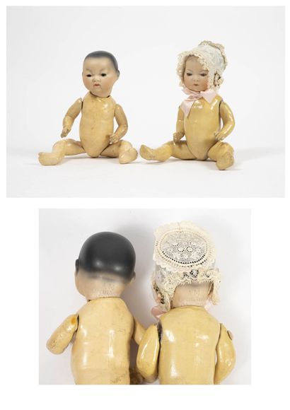 ARMAND MARSEILLE Two Asian twin dolls. 

Full porcelain heads with painted hair,...
