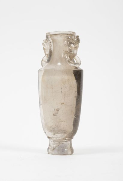 CHINE, XXème siècle A small rock crystal vase with a flattened body on a high heel...