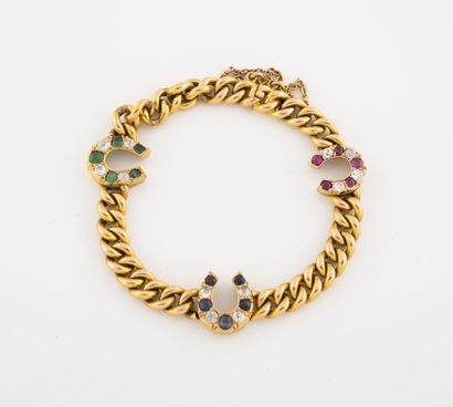 null Bracelet en or jaune (750) à maille gourmette alternée de trois motifs "Fer...