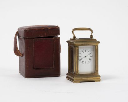 Brass officer's clock. 
Dial with cream background,...
