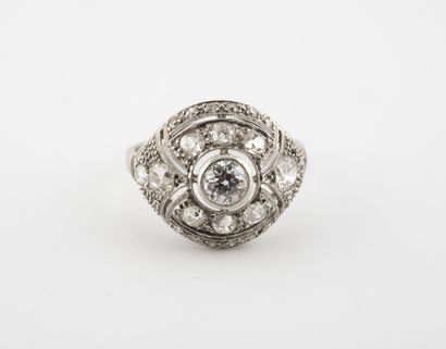 null Platinum ring (850) centered on a brilliant-cut diamond in a closed pearl setting...
